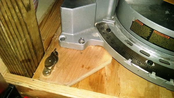 Gullion’s miter saw is screwed to a piece of plywood that connects to a home-made stand with the kind of sash locks used on double-hung windows.