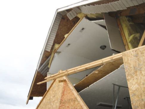A close look showed inadequate nailing of the drywall ceiling and the bonus-room floor sheathing to the bottom chord of the gable-end truss.