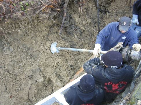 Helical soil anchors furnished tieback points for fixing the reinforced wall to the hillside. The anchor sub was familiar with retaining-wall design and recommended an appropriate depth and spacing for the anchors.