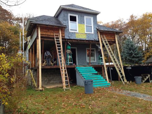 Hey — remember this? A photo of the house taken six months ago by homeowner Will Crosby shows the early demolition phase of the work.