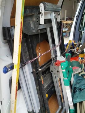 Keep your setup simple. There are lots of fancy tables and things out there that promise to make everything easy. Some of them probably do, but since few of us drive moving trucks, we have to get creative. I have a sturdy set of plastic sawhorses and 4' melamine shelf that is my all-purpose table (on larger jobs we'll set up a 2x8 workbench or a 4x8 assembly table). I have a folding stand for the table saw and a Sawhelper miter saw stand (the wings ride on top). The sawhorses and folding stands ride against the driver's side wall and are secured to the clip track with a bungee cord.