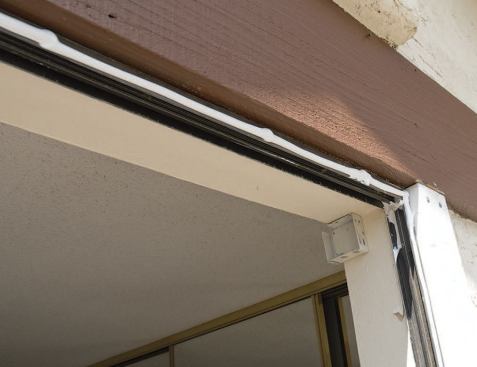 Extra sealant pumped into the upper and lower corners prevents water that may have leaked behind the stucco from exiting the wall cavity at the old window frame.