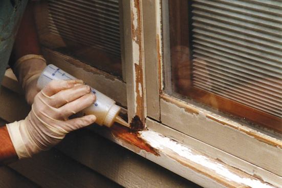 Rot damage needs to be repaired. Using liquid epoxy, the author saturates and consolidates areas that have minor rot