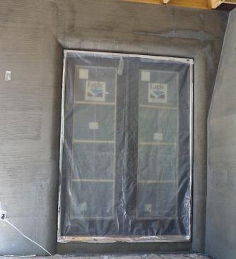 To help with adhesion, these walls received a second base coat, which was then scratched with diamond mesh lath.