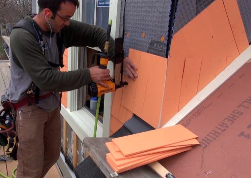 Pollard fastens shingles with stainless steel gun-driven staples.
