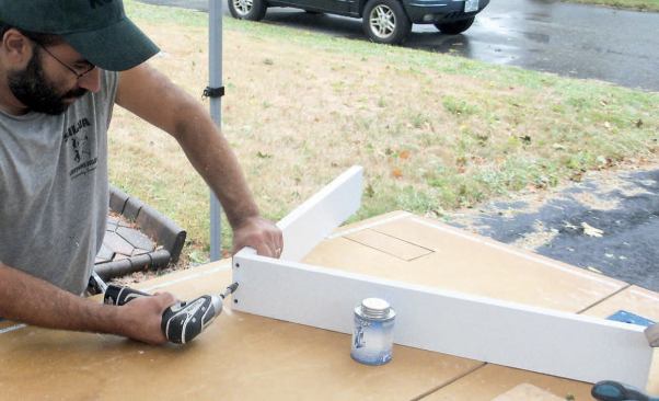 Next we cut two pieces of 5/4 PVC stock to match the original bracket's 90-degree backer.