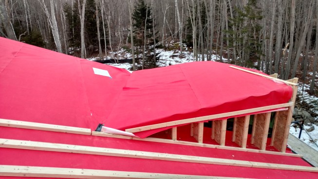 With the roof framing complete, the crew constructed a vented roof assembly. Vapor-open, water-resistive VaproShield SlopeShield roof membrane was attached to the rafters, and 2x4 furring laid on top of that.