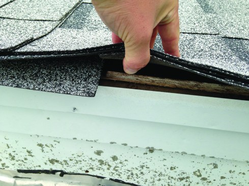 The roofer on this particular job did not install any drip-edge flashing, and you can see how the edge of the sheathing has weathered from exposure to water.