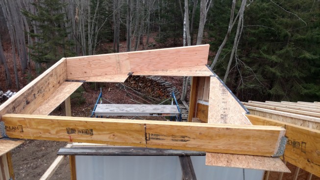 This allowed for its out-of-square and out-of-level orientation with respect to the common rafter supporting it at the uphill end, and the wallheader supporting it at the downhill end.