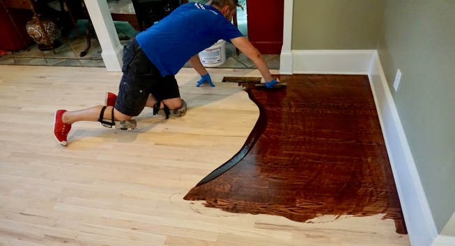 Working a section as wide as his arm can sweep, he covers the length of the room (about 18 feet) in about two minutes.