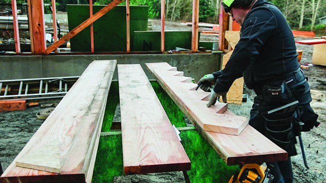 To keep stringers consistent, he uses the first stringer to lay out the second ... and (not shown) the third.