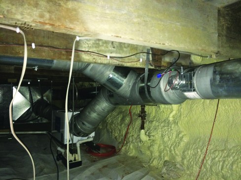 The author’s preferred HVAC solution for high-performance homes is a central heat-pump system, coupled to a fresh-air intake and dehumidifier. A long fresh-air-intake duct in the unconditioned basement helps to temper the incoming air for comfort. Dampers open and close the air intake in response to temperature conditions and prevent unwanted backflow through the dehumidifier.