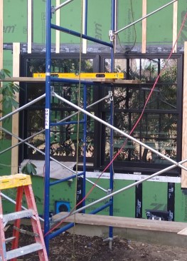 At the bottom of this image, a blue Quickflash panel is visible. We detailed most of our electrical, HVAC, and water penetrations with gaskets like Quickflash. 