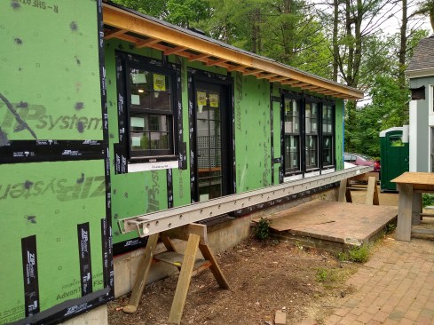 or optimal water and air detailing, we apply Zip Liquid Flash over all nail holes, loose tape, or scratches in the green Zip WRB. In this area, we built the soffit over the Zip R-3. The sheathing connects to the air-sealing layer that travels 1 inch below the roof sheathing. This allows an overroof for airflow.