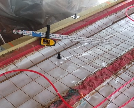 We used the trick of drawing a line around the structure on plan sections to see where the discontinuities of the control layers were (see “Air Barrier Basics,” by Steve Bazcek, Jan/19). In this area, we had to remove an existing slab to create continuity from slab to foundation to sill. The vapor-barrier is sealed to the foundation where a liquid-applied barrier continues to the sill plate. The sill plate is gasketed and caulk-sealed to the foundation. 