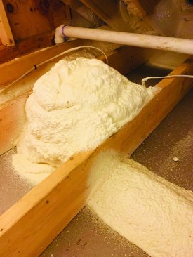 The spray-foam contractor then seals the hats down to the attic floor with a flash coat of high-density closed-cell polyurethane foam.