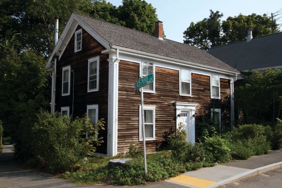 The house was built on a lot that sloped immediately down from street level, which set the front door sill about 9 inches lower than the sidewalk.
