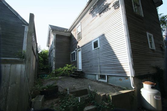 At the back of the original building was an extension that had been built in the 1920s on a full foundation of hand-mixed concrete interlaced with bricks and rubble.