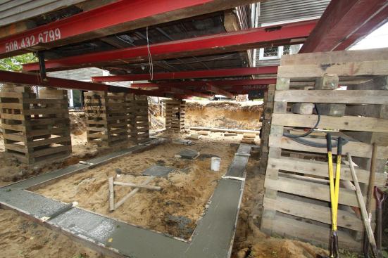 We placed four needles parallel to the joists, shimming as needed to pick up the central timber and to make sure that all three sills in the addition were fully supported.