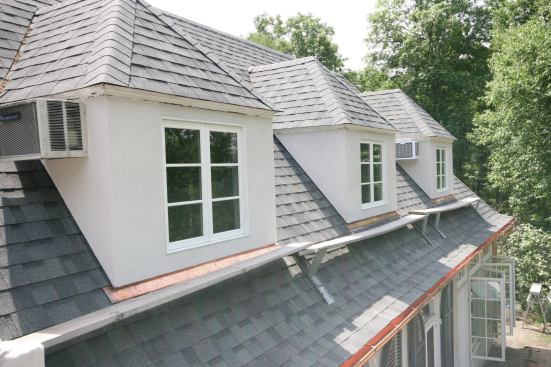 Although this house had stucco-clad dormers with asphalt shingles, this flashing detail can be used on  a variety of siding and shingle types.