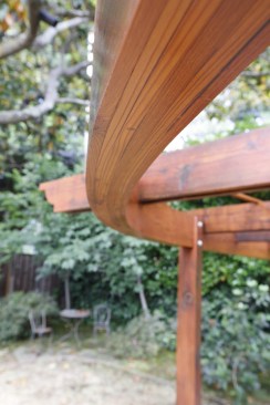 The curved beam measures 3 5/8 inches thick.