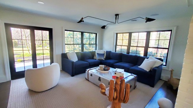 The project's new design included 50 double-hung, four casement, and three fixed arch-top windows, three entry doors, three sliding patio doors, and one massive double entry with sidelights.