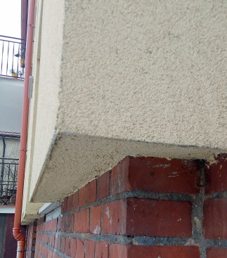 Old walls retrofit with continuous exterior insulation that is cladd with traditioal stucco.