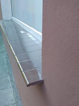 Tile window sill with formed drip edge