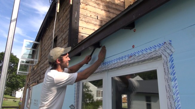 Continuous insulation (CI) is added to the exterior to limit the conductive heat losses through the framing. (photo: Ted Cushman)