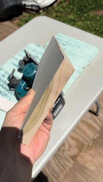 The author makes the first cut with a planer with a 5-degree back bevel, which makes finer adjustments easier and helps the base sit tighter to the floor, but you can use a table saw or jigsaw instead.