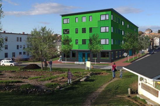 A simple form and regular detailing helped keep this 43-unit high-performance multifamily structure affordable. But cost constraints still required simplification of energy and finish details.