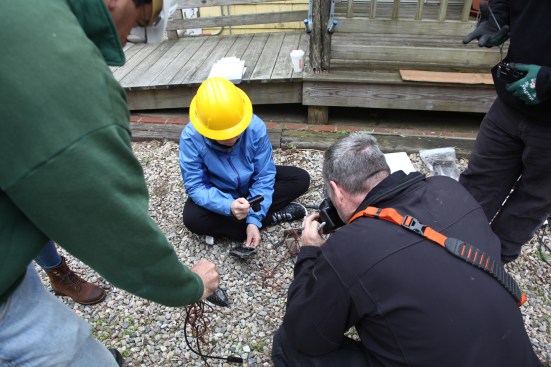 The team examines all of the burned electrical parts in an effort to determine the cause of the blaze.