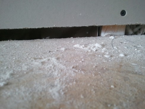 Next, the builder applies drywall to the room walls—leaving space below the drywall for the carpet installers to attach a tack strip.