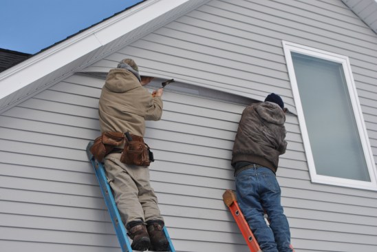 Finally, they replace the vinyl siding, leaving no visible trace that any repair ever happened.