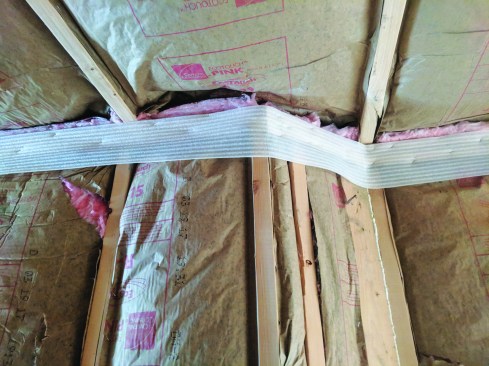 Here, the builder has applied sill-sealer material to the top plates in a home.