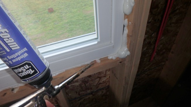 In typical production building in the author’s market, the most practical way to air-seal around windows is with gun foam.