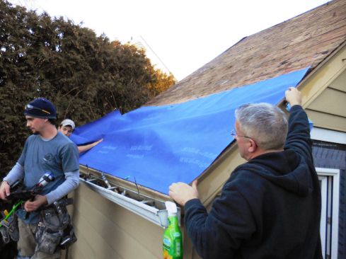 The author and his crew spread Majvest weather barrier membrane over the original board sheathing of the roof. With a U.S. perm rating of 68, Majvest is vapor open, but it resists driving rain.