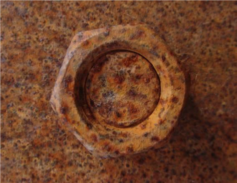 After 3 years of exposure in an inland environment, mild steel nuts exhibited considerable surface corrosion, but were still structurally functional.