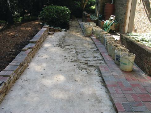 Installed in 1996, this North Carolina brick patio began to come apart within 10 years. But what started out as a repair of a few loose bricks turned into a major replacement job, thanks to faulty installation details and poor drainage.