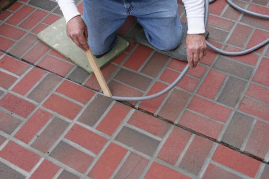 Prior to caulking the expansion joints, the author installed foam backer to keep the sealant from sticking to the bottom of the joint. The top of the backer rod is recessed about 3/8-inch below the top of the joint, ensuring that the joint depth equalled the approximate width of the joint. 