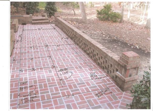 Here's a photo of the installed brick patio, with the layout lines superimposed on the photo. Note how the pattern is centered along both the length and width of the patio. 