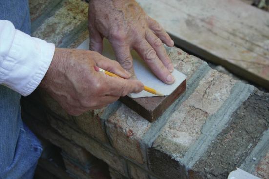 For complex cuts, cardboard templates can be used to check for fit and to mark the brick.  