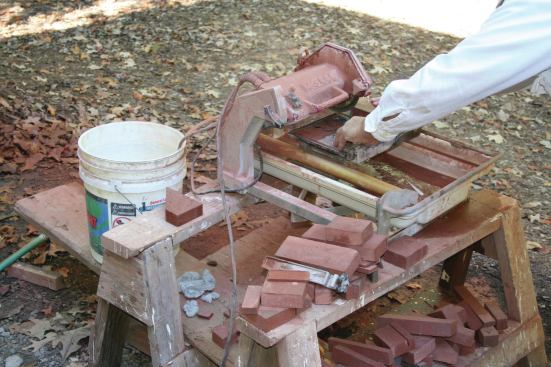 Because the brick pavers measured 1 3/8-in. thick (rather than the full 2-inch thickness of a standard brick), the author was able to use a smaller tile saw rather than his 14-inch brick saw to make most cuts. 