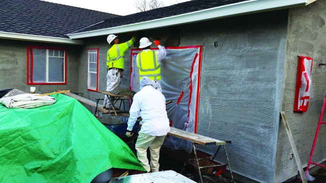 After the scratch coat has been moist-cured for at least 48 hours, the brown coat is applied with firm pressure to create a strong mechanical and chemical bond between the coats. The brown coat should be rodded flat with a darby and straightedge, then moist-cured and checked for hardness.