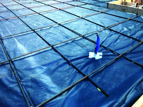 Sealing down low. Stack effect—the movement of heated air  from the bottom to the top of a house on a cold day—tends  to draw air into a home at the base, making air leaks low on  the house among the most important to seal. The author’s  crew accomplishes this in multiple ways. Before the slab is  poured, all penetrations are sealed to the sub-slab poly, and the author keeps stub-ups separate so they can be sealed  effectively (multiple stubs are nearly impossible to seal well).
