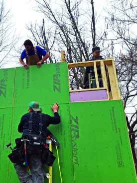 The Aarow Building crew leaves window and door openings sheathed for the duration of the framing.