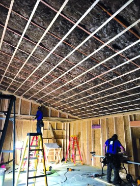 Ceiling strapping helps flatten the ceiling - a particularly important detail on this sloped ceiling, which will be raked by daylight from clearstory windows.