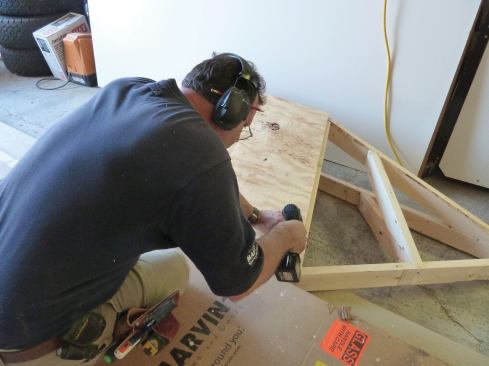 The roof sheathing sections were cut and temporarily tacked onto the bay roof on the bench.