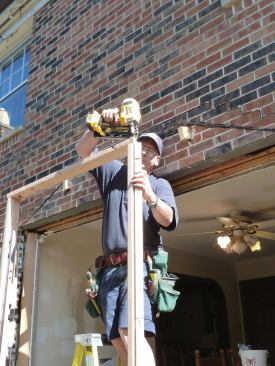 A 2x4 plate is nailed to the tops of the posts for setting the roof.