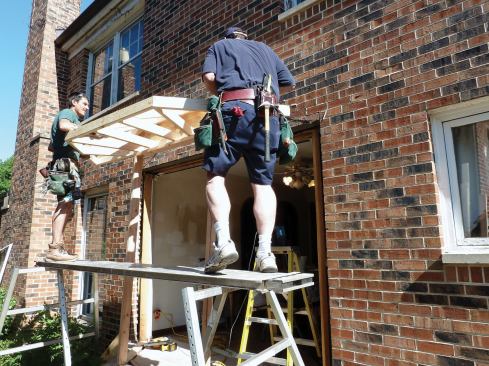 At 50 pounds, the roof assembly was easy to lift into place.